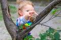 The child looks at the snail. Selective focus. Royalty Free Stock Photo