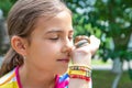 The child looks at the snail. Selective focus. Royalty Free Stock Photo