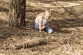 Child looks at the unexploded bomb Royalty Free Stock Photo