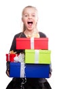 Child with a lot of gift boxes in hands on isolated background Royalty Free Stock Photo