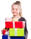 Child with a lot of gift boxes in hands on isolated background Royalty Free Stock Photo