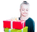 Child with a lot of gift boxes in hands on isolated background Royalty Free Stock Photo