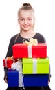 Child with a lot of gift boxes in hands on isolated background Royalty Free Stock Photo