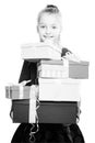 Child with a lot of gift boxes in hands on isolated background Royalty Free Stock Photo