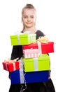 Child with a lot of gift boxes in hands on isolated background Royalty Free Stock Photo