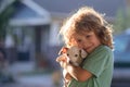 Child lovingly embraces his pet dog. Cute kids boy enjoying with her best friend dog. Positive emotions of children. Royalty Free Stock Photo