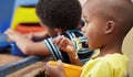 Child, lunch and eating in school, kindergarten or classroom and healthy nutrition, food and noodles. Kids, black boy