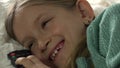 Child Lying on Bed Watching TV, Happy Smiling Portrait Girl Relaxing on Sofa