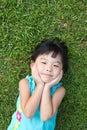 Child lying on grass