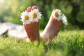 Child lying in meadow relaxing in summer sunshine Royalty Free Stock Photo