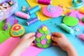 Child made Easter egg decor from felt. Small child holds a felt Easter egg decor in his hands. Easter crafts set