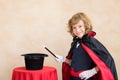 Child magician holding magic wand Royalty Free Stock Photo