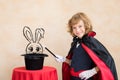 Child magician holding magic wand Royalty Free Stock Photo