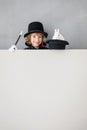 Child magician with rabbit holding banner blank Royalty Free Stock Photo