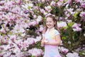 Child with magnolia flower. Little girl with flowers Royalty Free Stock Photo