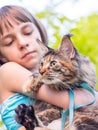 Child with Maine Coon kitten Royalty Free Stock Photo