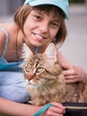 Child with Maine Coon kitten Royalty Free Stock Photo