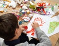 Child make crafts and toys, handmade concept. Artwork workplace with creative accessories.