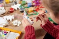Child make crafts and toys, handmade concept. Artwork workplace with creative accessories.