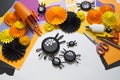 The child makes black spiders of paper. Master Class. Handmade crafts.