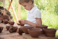 The child makes dishes and various figures from clay. Pottery skills. Hobbies and interests. Children`s education