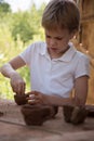 The child makes dishes and various figures from clay. Pottery skills. Hobbies and interests. Children`s education