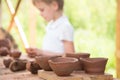 The child makes dishes and various figures from clay. Pottery skills. Hobbies and interests. Children`s education