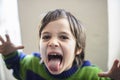 Child makes grimaces Royalty Free Stock Photo