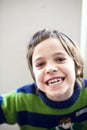 Child makes grimaces Royalty Free Stock Photo