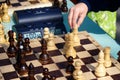 The child makes a move in a chess game. Royalty Free Stock Photo