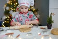 Child making Christmas cookies