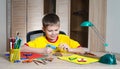 Child making Christmas decorations. Make christmas decoration with your own hands.