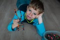 Child making DNA model from sticks and clay, engineering and STEM