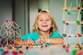 Child making geometric shapes, engineering and STEM Royalty Free Stock Photo