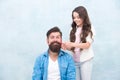 Child making hairstyle styling father beard. Being parent means present for kid interests. Change hairstyle. Create