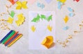 Child making homemade greeting card. little girl making card for mom with flowers from paper as gift for Mothers day, Birthday or