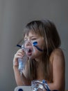 Child making inhalation with mask on his face. Asthma problems concept Royalty Free Stock Photo