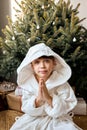 Child Making Magic Wish for Winter Holidays. Boy Near the Christmas Tree at Home. Royalty Free Stock Photo