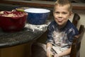 Child making a mess baking with mom Royalty Free Stock Photo