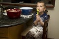 Child making a mess baking with mom Royalty Free Stock Photo