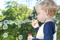 Child making soap bubbles Royalty Free Stock Photo