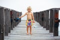 Child with mask, fins going to snorkel in tropical sea Royalty Free Stock Photo