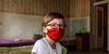A child in a mask on inpatient treatment in a hospital
