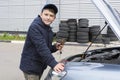 Child mechanic working in the garage. Repair service