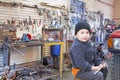 Child mechanic working in workshop