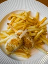 Child menu - french fries and chicken cutlets in the form of popsicle