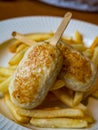 Child menu - french fries and chicken cutlets in the form of popsicle