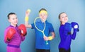 Child might excel completely different sport. Sporty siblings. Girls kids with boxing sport equipment and boy tennis