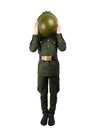 Child in military uniform, covered his face with a helmet