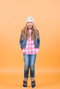 Child model with long blond hair smile and stand tiptoe